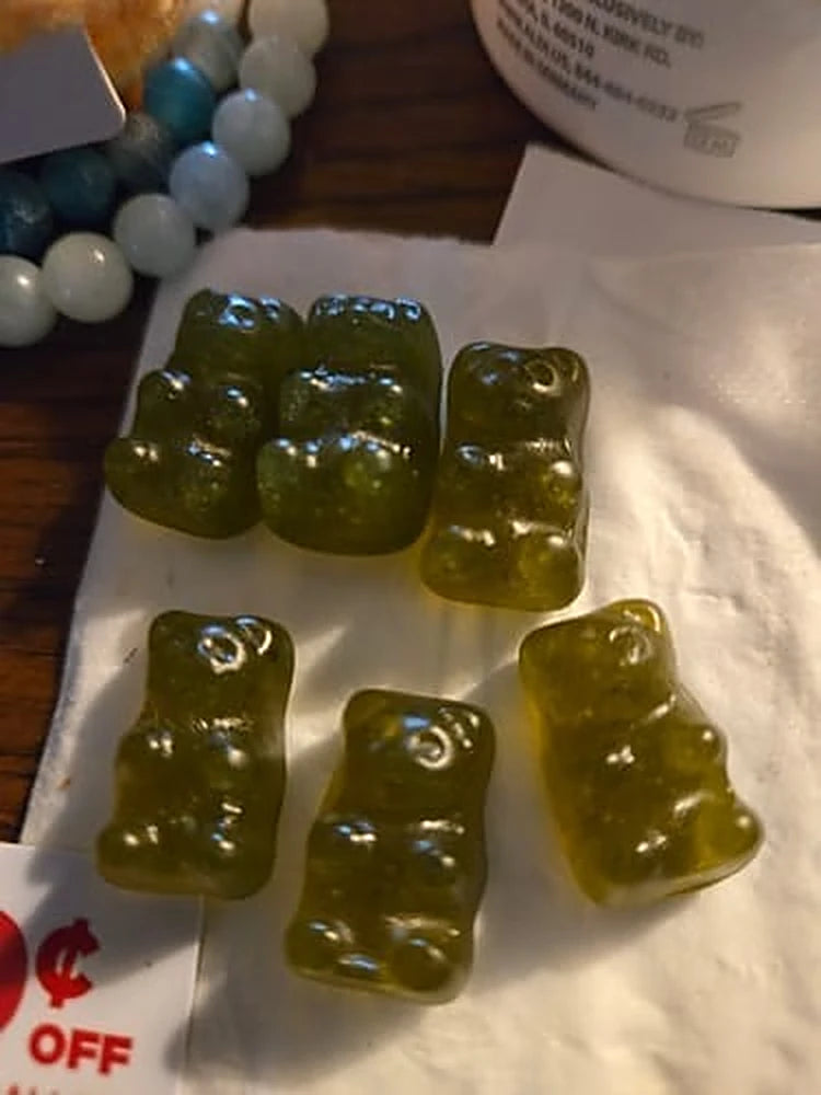 A customer photo of six Optimal Human greens gummies on a napkin