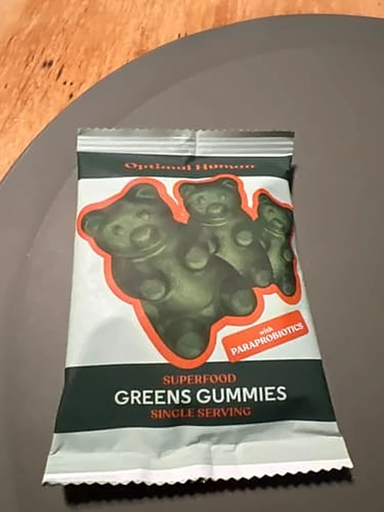 A customer photo of a single-serve greens gummies sachet on a table