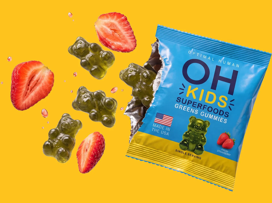 An open OH Kids pack with green gummy bears and strawberries flying out on a yellow background