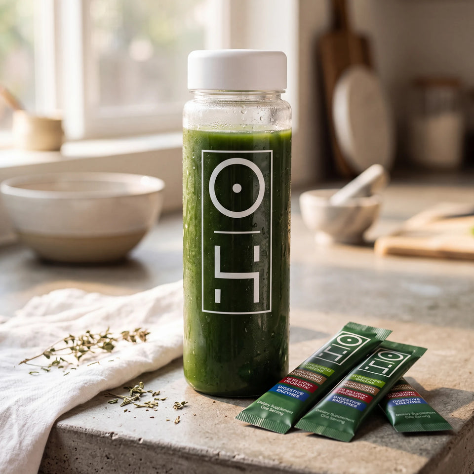 A bottle of mixed Superfood Greens on a kitchen counter with stick packs